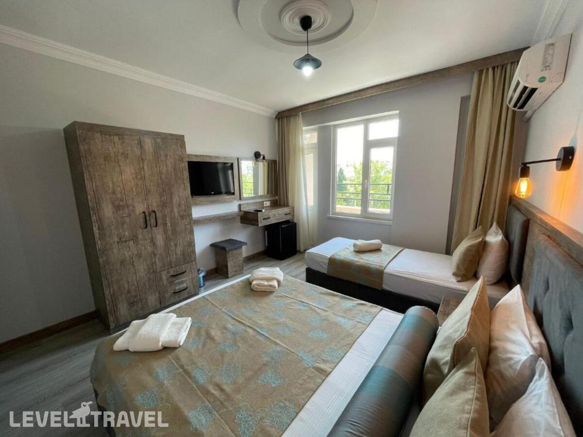 фотографии номера Трехместный номер отеля Seven City Hotel в Турция(Анталья - Центр) - фото №14