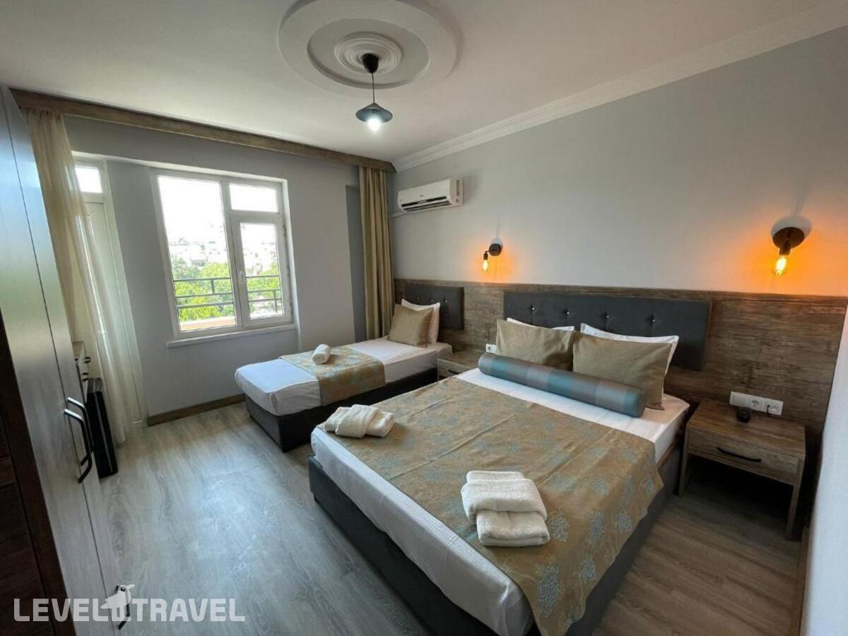 фотографии номера Трехместный номер отеля Seven City Hotel в Турция(Анталья - Центр) - фото №11