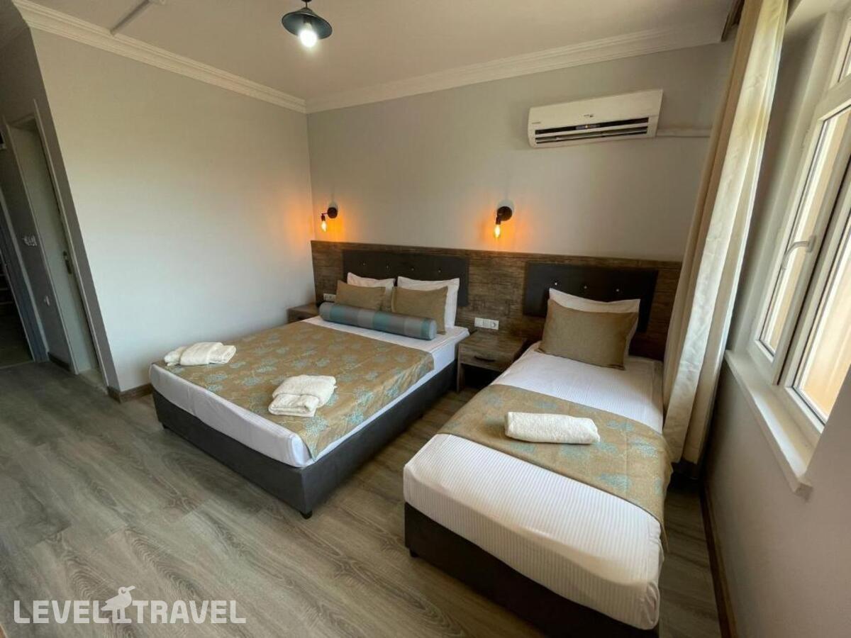 фотографии номера Трехместный номер отеля Seven City Hotel в Турция(Анталья - Центр) - фото №10