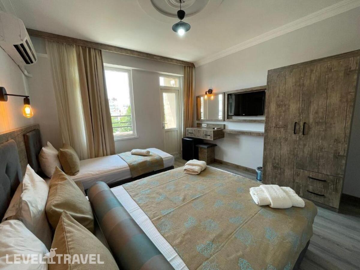 фотографии номера Трехместный номер отеля Seven City Hotel в Турция(Анталья - Центр) - фото №4