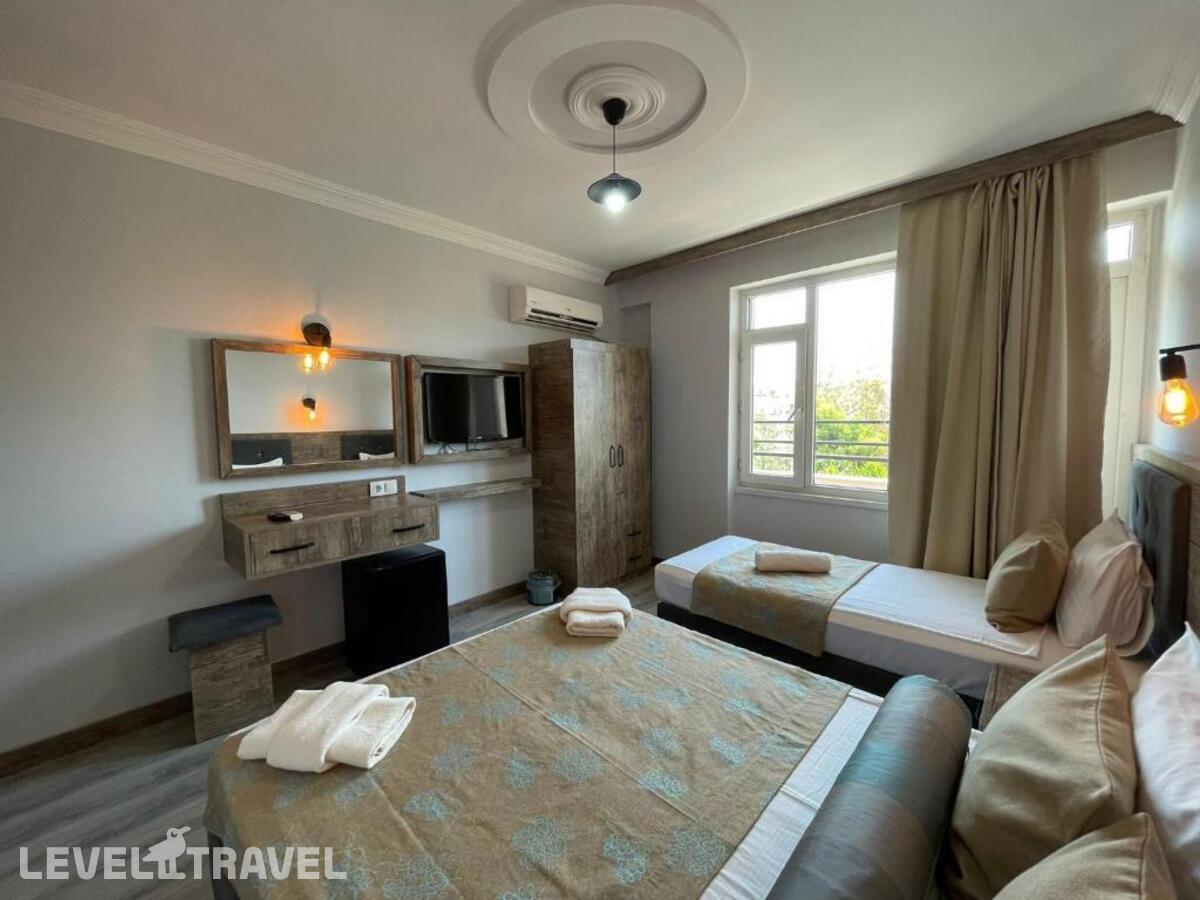 фотографии номера Трехместный номер отеля Seven City Hotel в Турция(Анталья - Центр) - фото №9