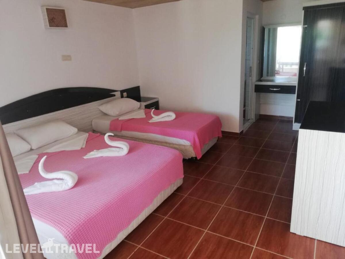 фотографии номера Трехместный делюкс отеля Esmeralda Butik Hotel в Турция(Кызылот) - фото №2
