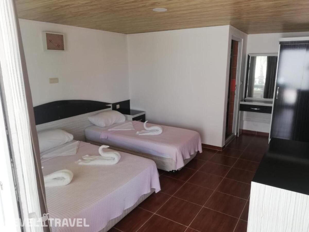 фотографии номера Трехместный делюкс отеля Esmeralda Butik Hotel в Турция(Кызылот) - фото №1