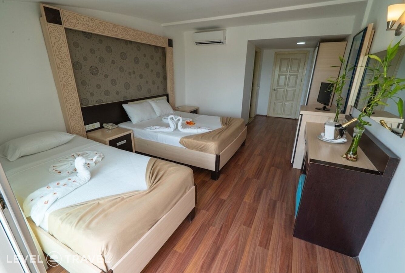 фотографии номера Семейный номер отеля Aperion Beach Hotel в Турция(Кызылот) - фото №9