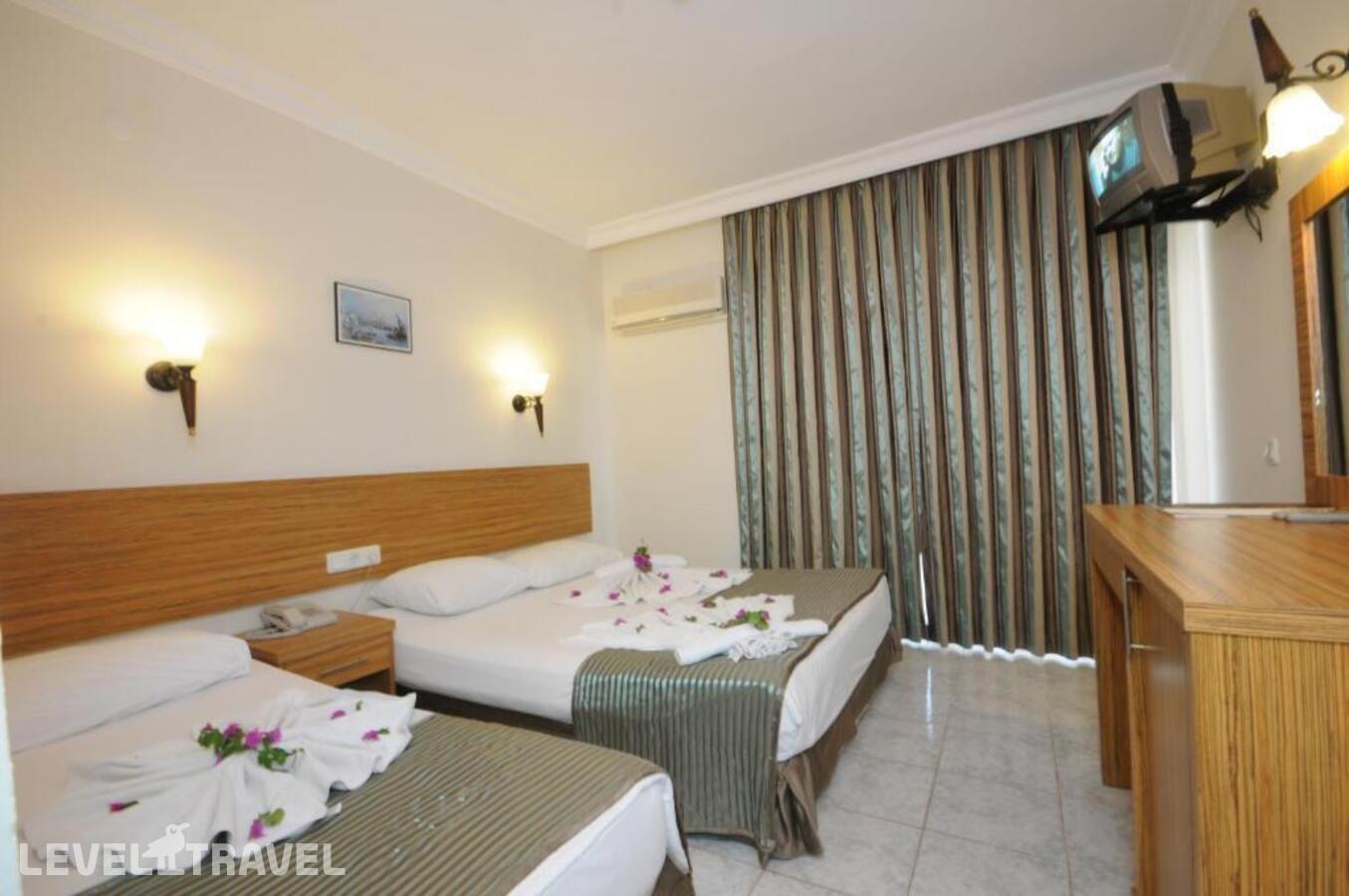 фотографии номера Одноместный номер отеля Mert Seaside Hotel (Adults Only 16+) (Ex. Cle Seaside Hotel, Ex. Armar Seaside) в Турция(Мармарис - центр) - фото №1