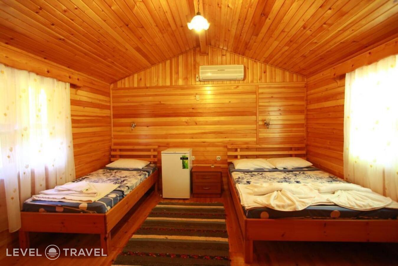 фотографии номера Трехместное бунгало отеля Baris Pension & Bungalows в Турция(Чиралы) - фото №3