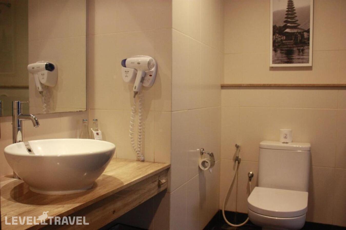 фотографии номера Делюкс отеля Quest Hotel Tuban в Индонезия(Кута) - фото №5