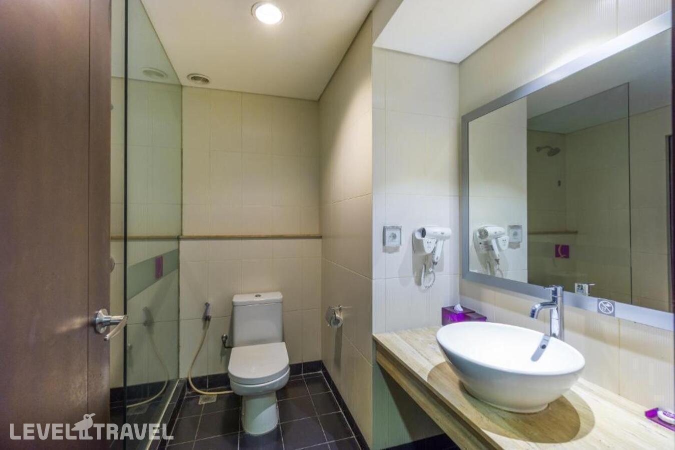 фотографии номера Делюкс отеля Quest Hotel Tuban в Индонезия(Кута) - фото №2