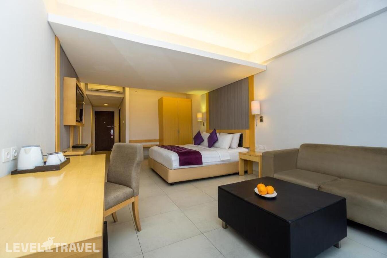 фотографии номера Полулюкс отеля Quest Hotel Tuban в Индонезия(Кута) - фото №3