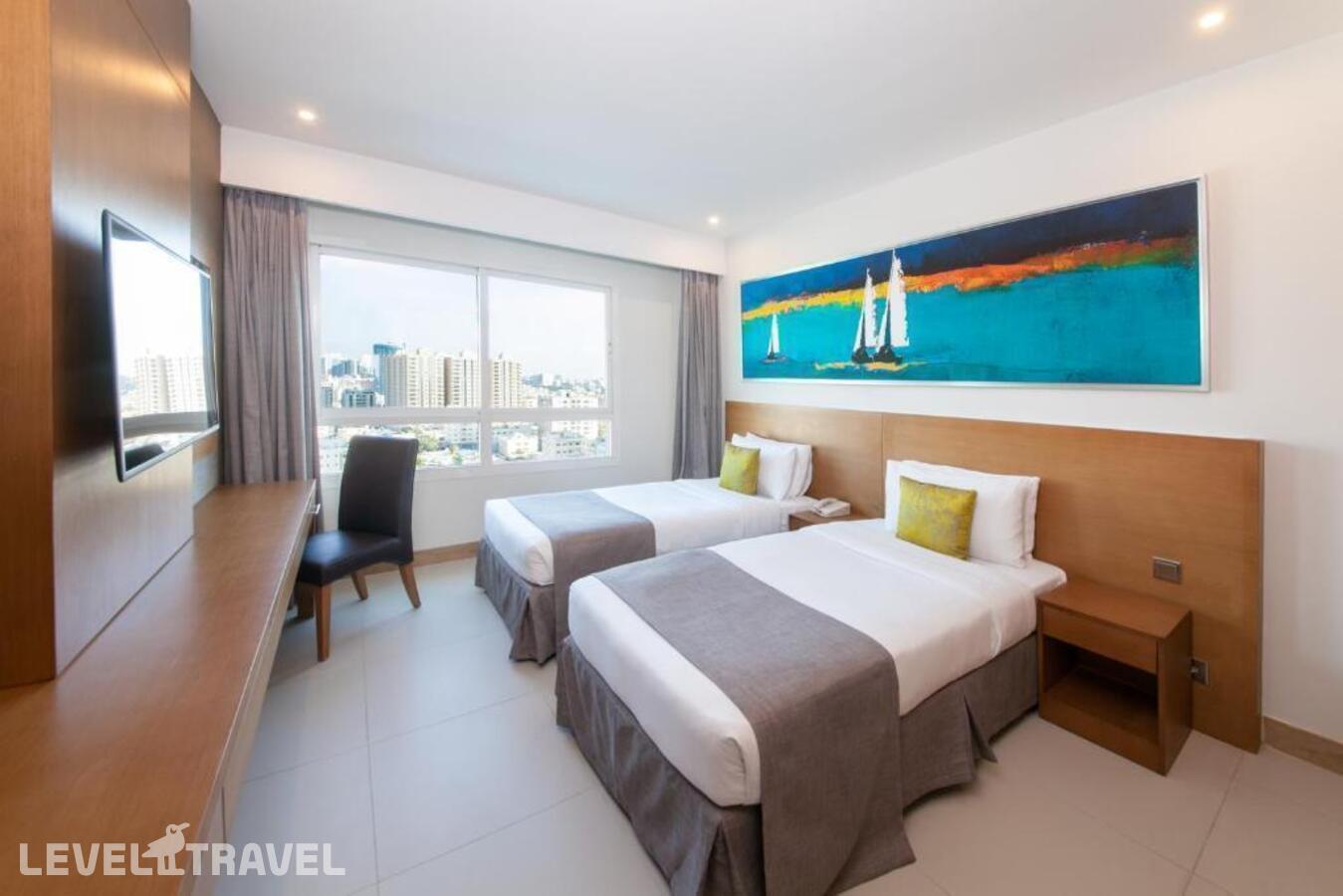 фотографии номера Стандартный (две односпальные кровати) отеля Ramada Beach Hotel Ajman By Wyndham в ОАЭ(Аджман) - фото №1