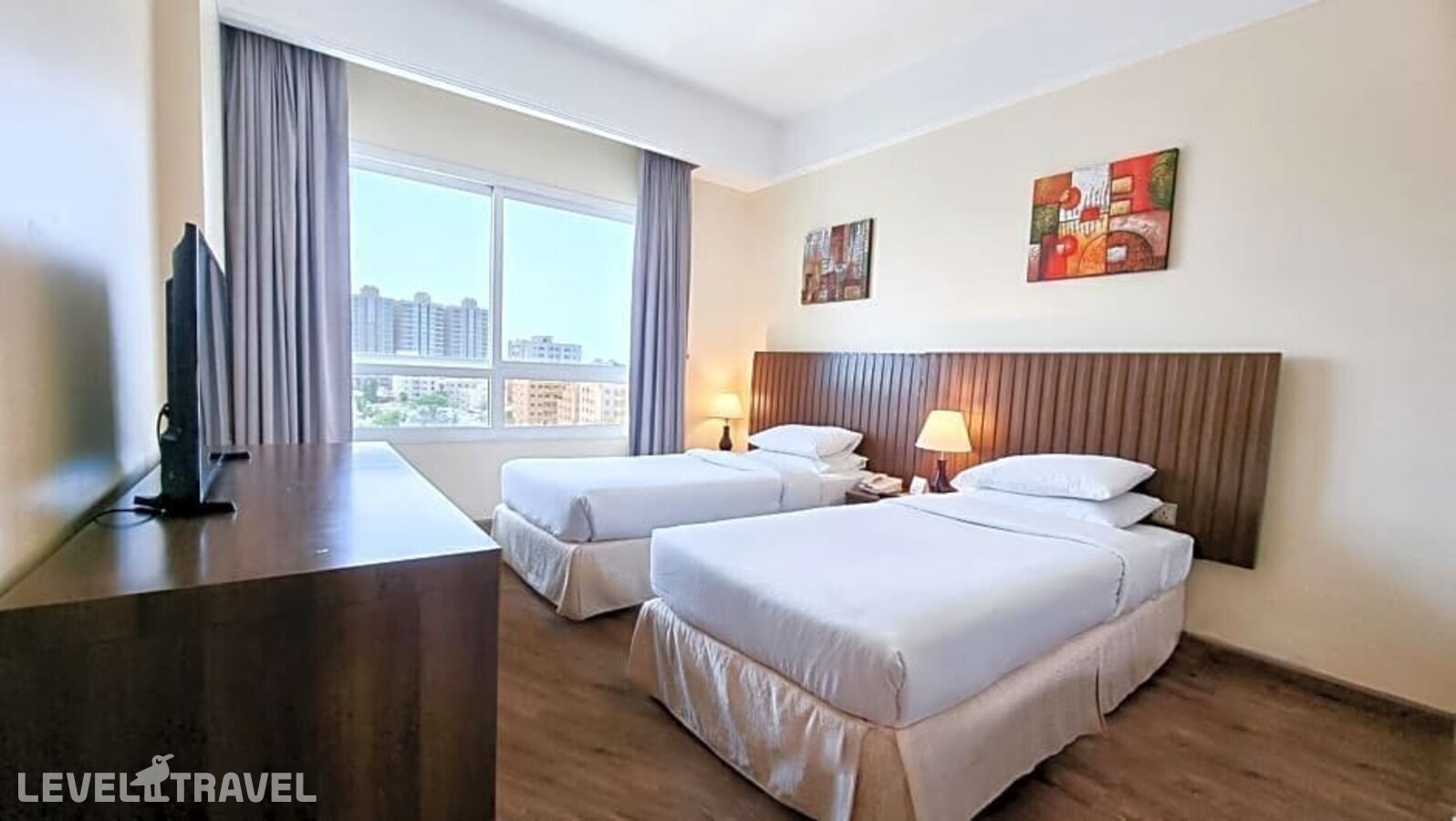 фотографии номера Стандартный (две односпальные кровати) отеля Ramada Beach Hotel Ajman By Wyndham в ОАЭ(Аджман) - фото №11