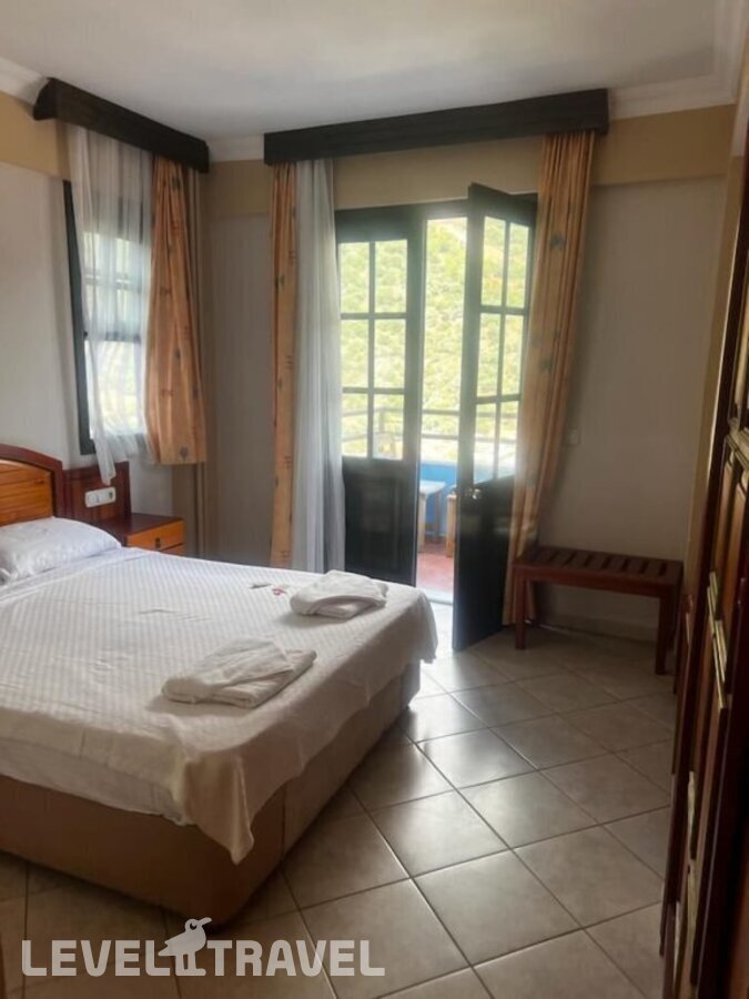 фотографии номера Стандартный с видом на море отеля Bellevue Hotel Fethiye в Турция(Олюдениз) - фото №2