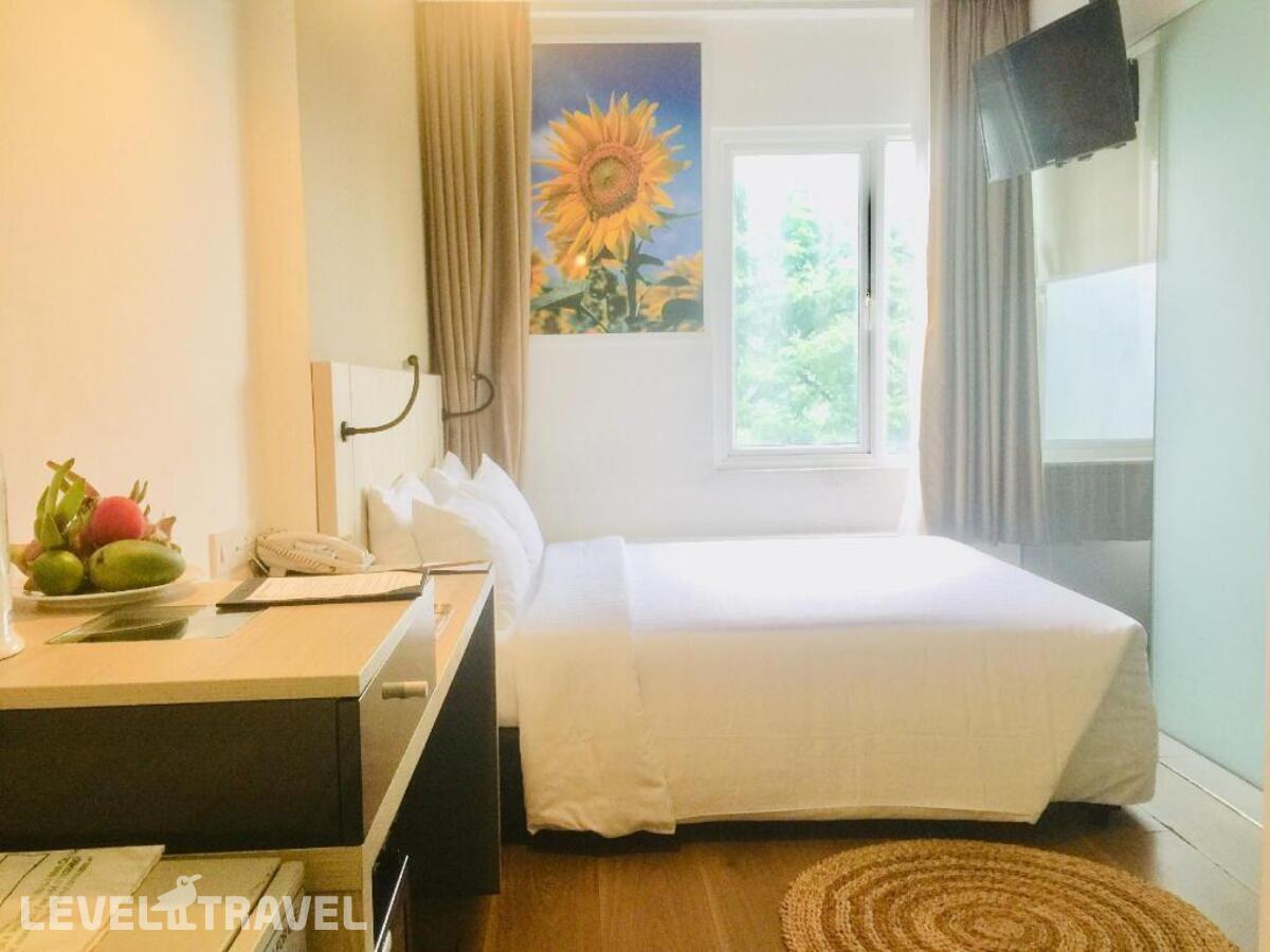 фотографии номера Делюкс с видом на город отеля Liberty Hotel Saigon Greenview в Вьетнам(Хошимин (Сайгон)) - фото №1