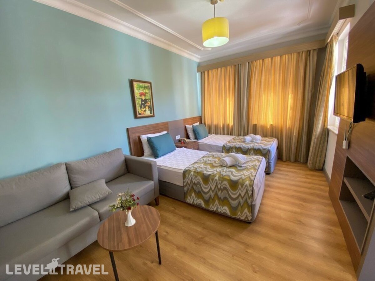фотографии номера Семейный с балконом отеля Side Village Hotel в Турция(Кумкёй) - фото №1