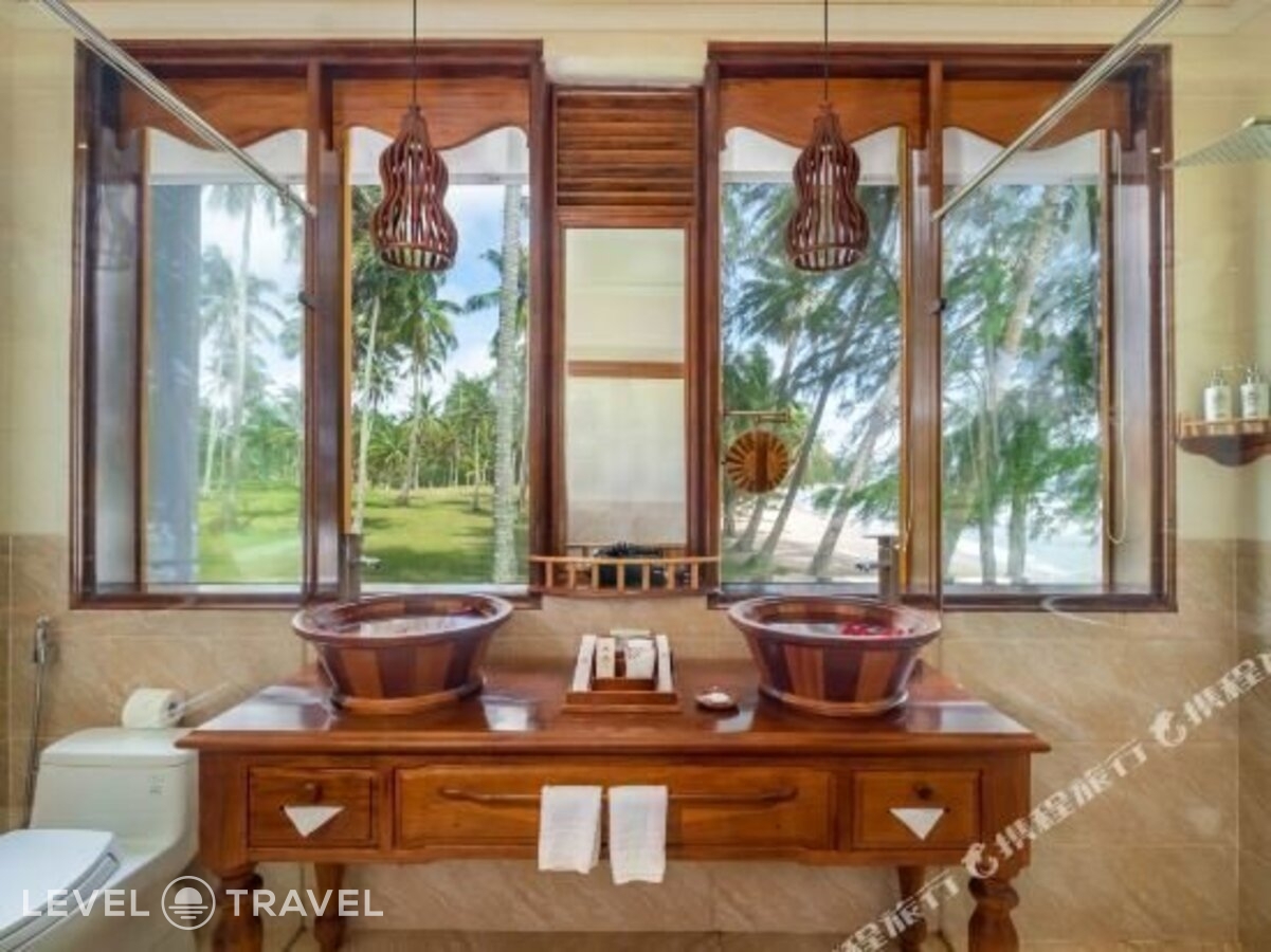 фотографии номера Делюкс с частичным видом на море отеля Coco Palm Beach Resort & Spa в Вьетнам(Фукуок) - фото №6