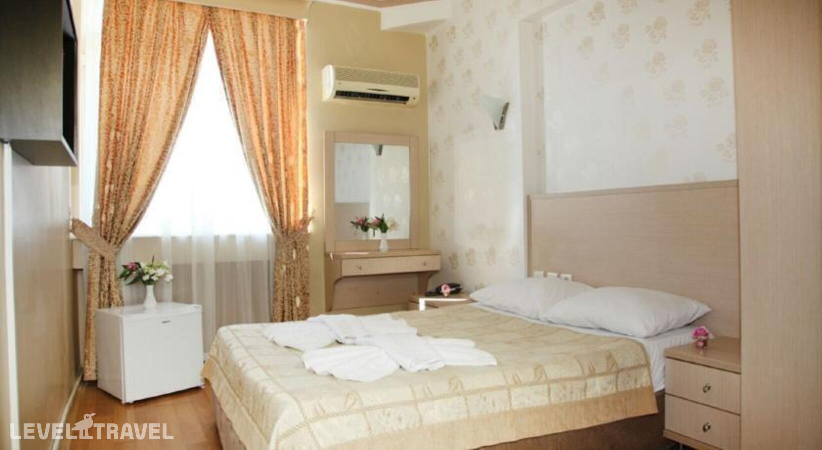 фотографии номера Стандартный с видом на окрестности отеля Erdem Hotel в Турция(Коньяалты) - фото №1