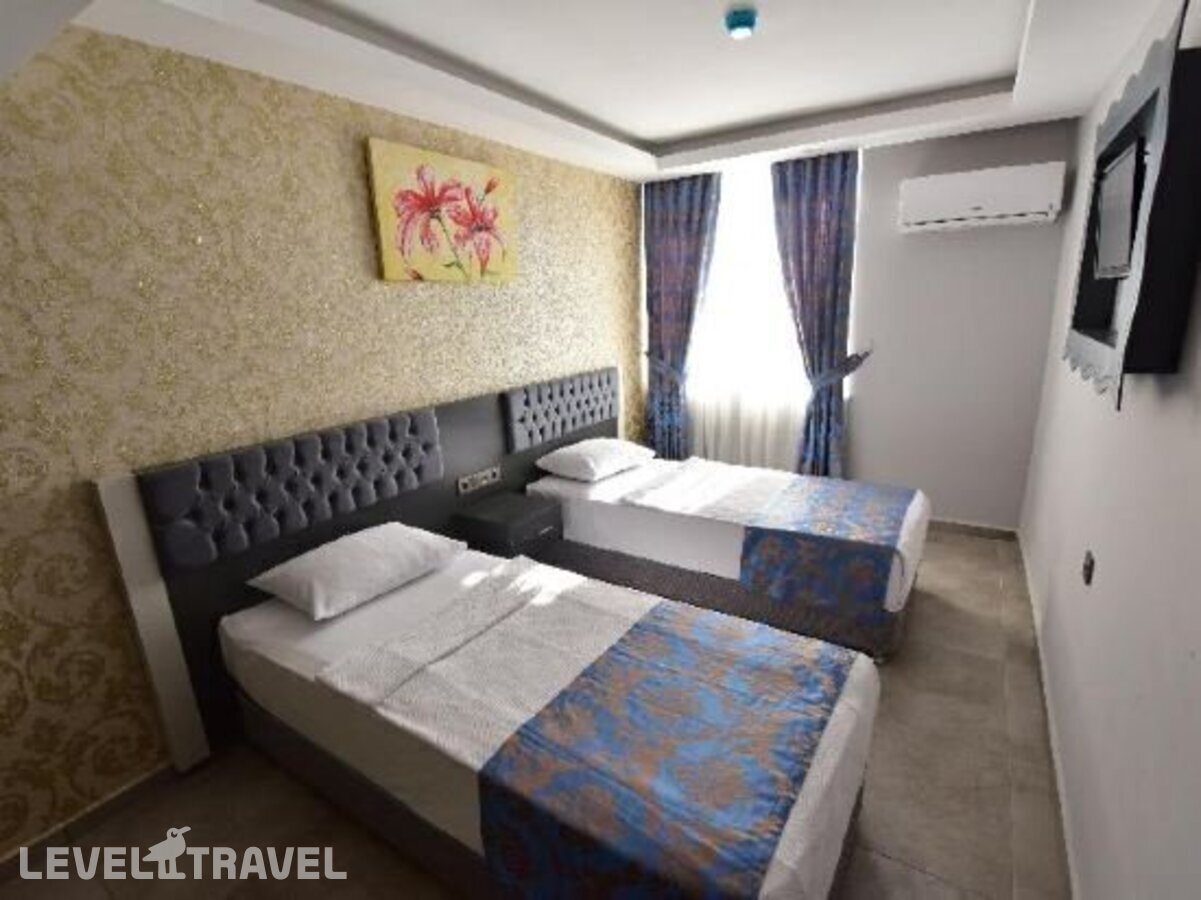 фотографии номера Стандартный с видом на окрестности отеля Erdem Hotel в Турция(Коньяалты) - фото №3