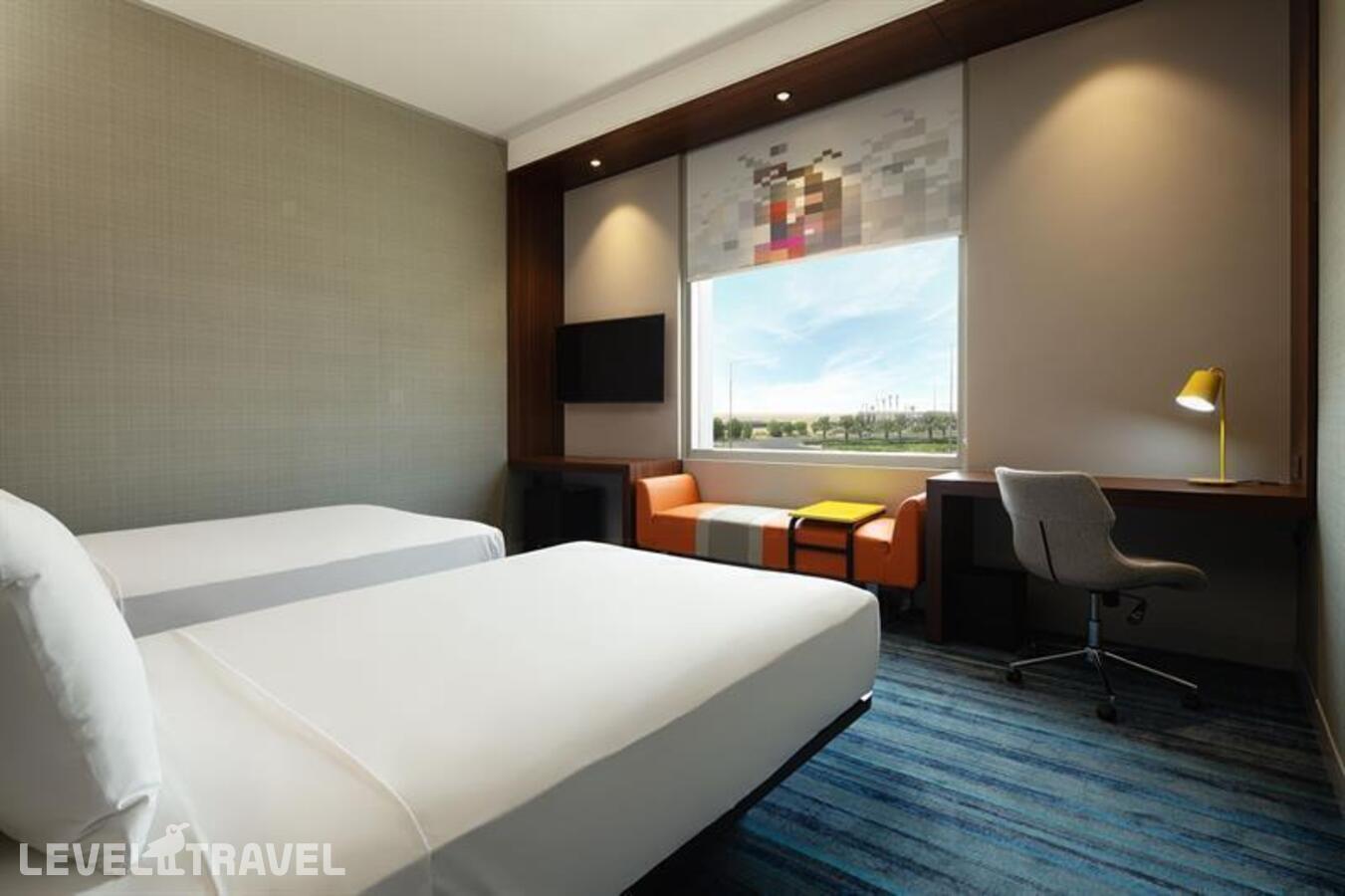 фотографии номера Стандартный номер отеля Aloft Dubai South в ОАЭ(Мадинат эль Мактум) - фото №2