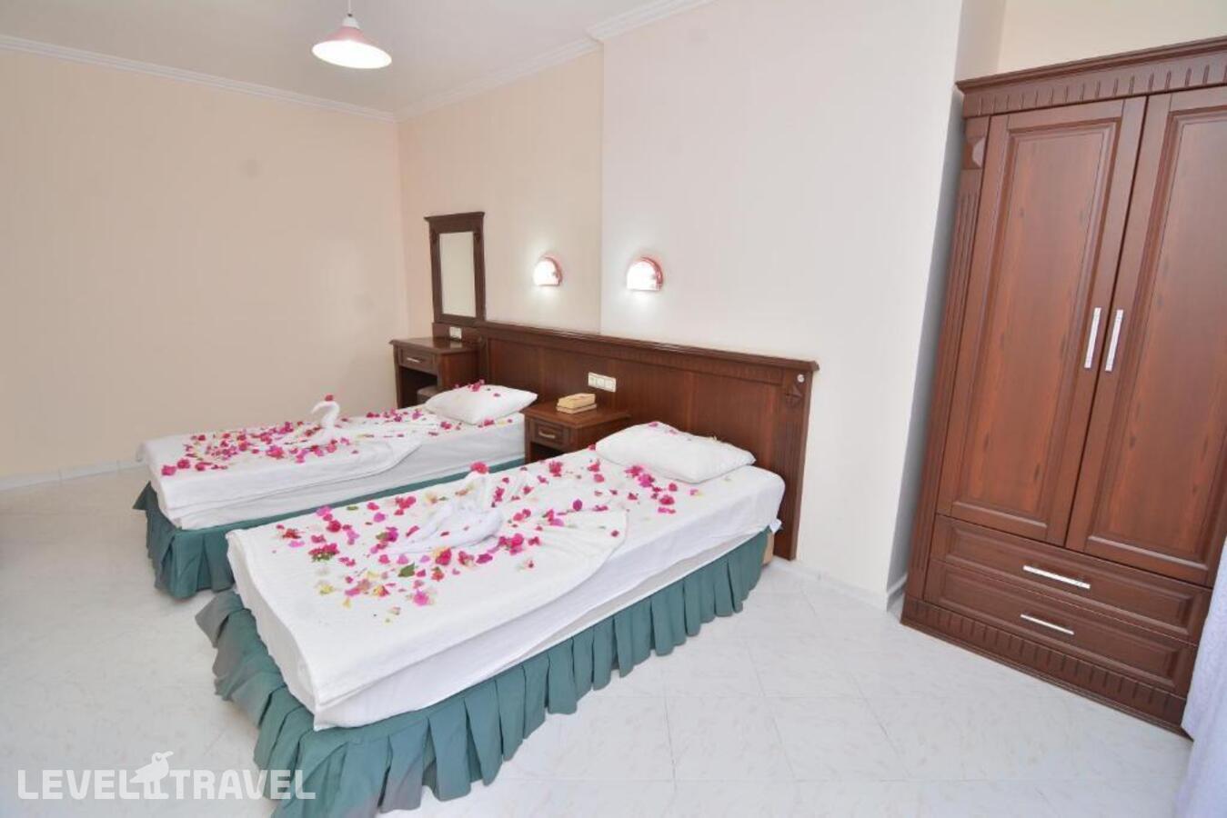 фотографии номера Четырехместный номер отеля Rose Garden Apart Hotel в Турция(Аланья) - фото №5