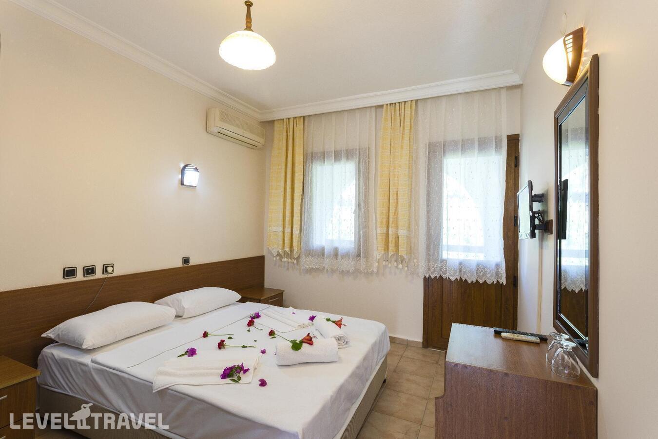 фотографии номера Стандартный номер отеля Gumbet Anil Beach Hotel в Турция(Гюмбет) - фото №3