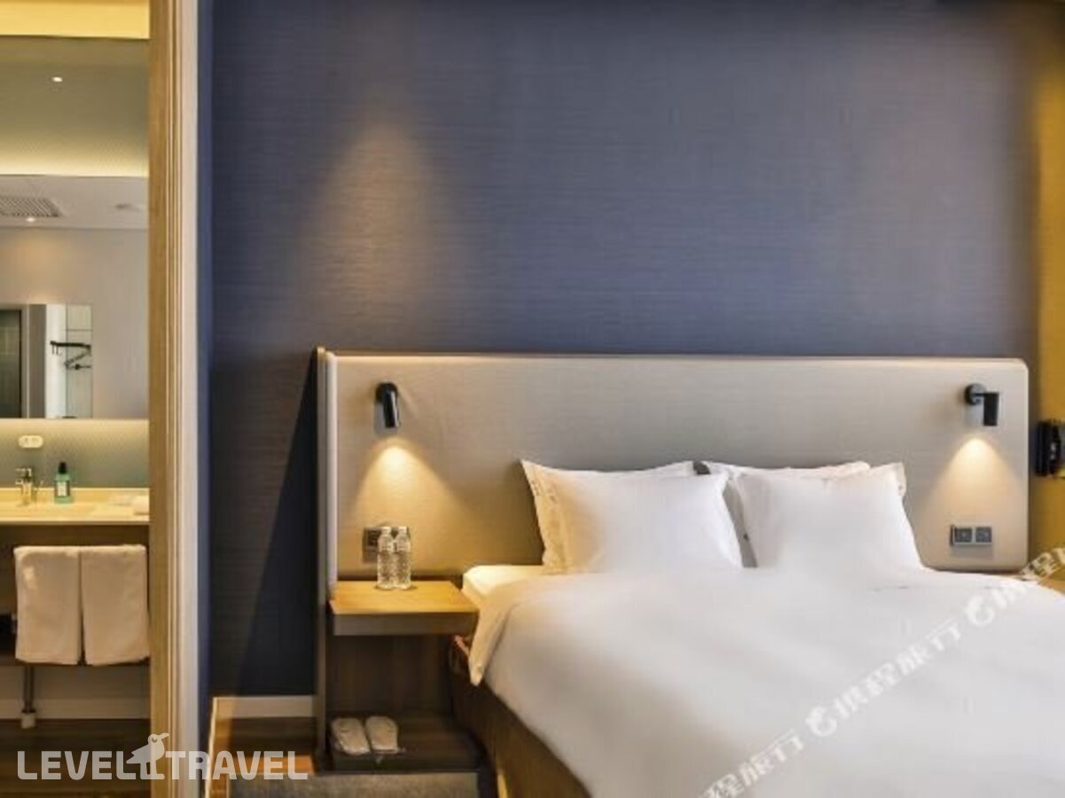 фотографии номера Семейный номер отеля Holiday Inn Express Harbin Qunli в Китай(Харбин) - фото №21