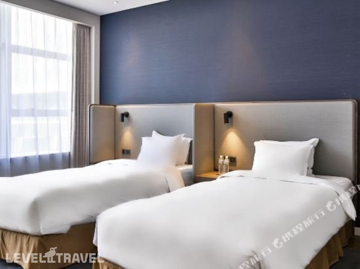 фотографии номера Семейный номер отеля Holiday Inn Express Harbin Qunli в Китай(Харбин) - фото №24