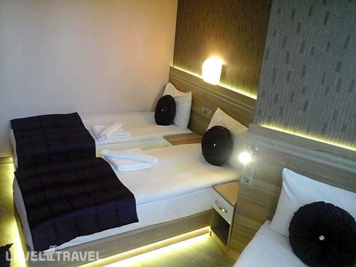 фотографии номера Стандартный номер отеля Olimpiyat Otel Izmir в Турция(Измир) - фото №10