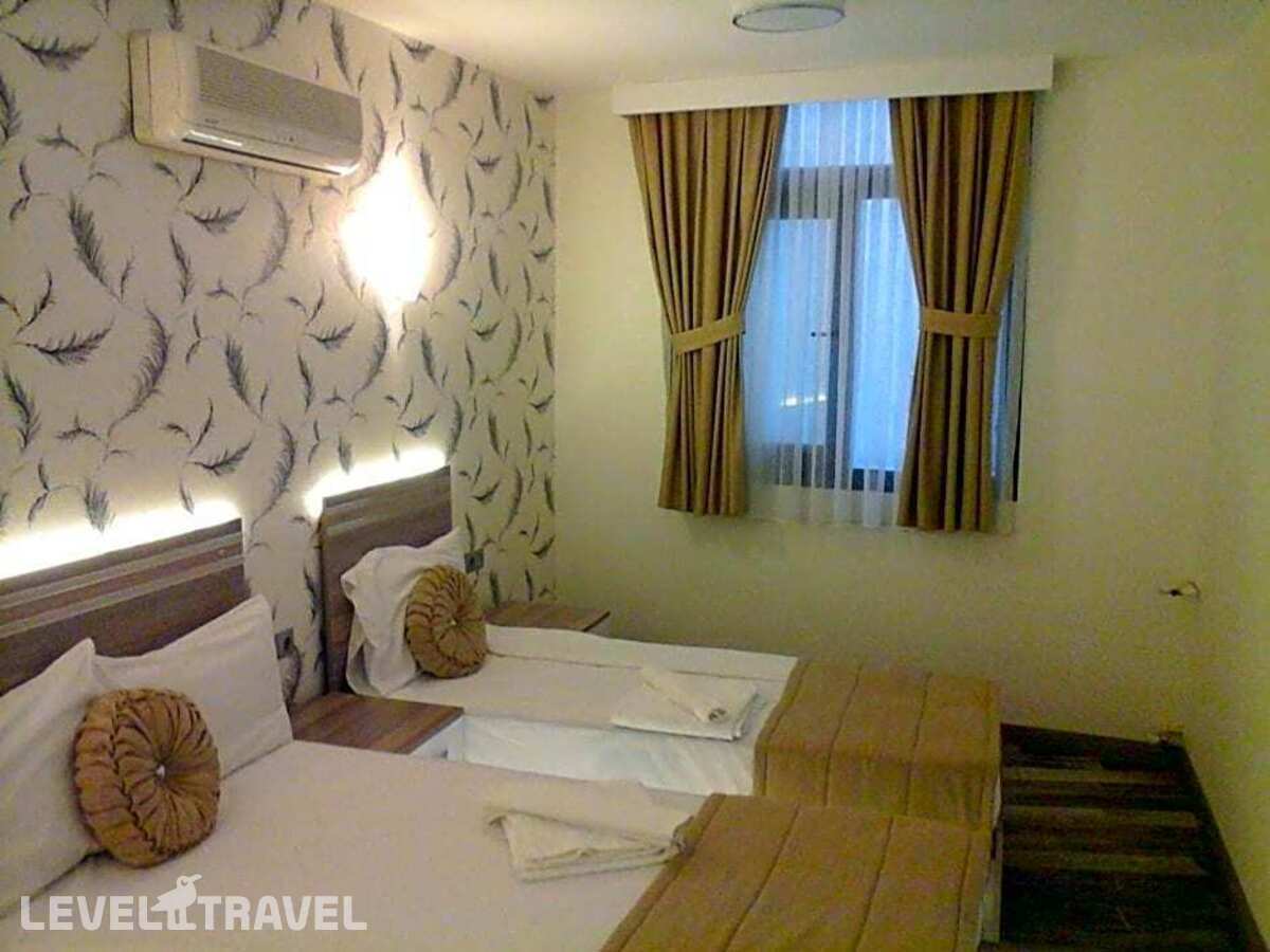фотографии номера Стандартный номер отеля Olimpiyat Otel Izmir в Турция(Измир) - фото №6