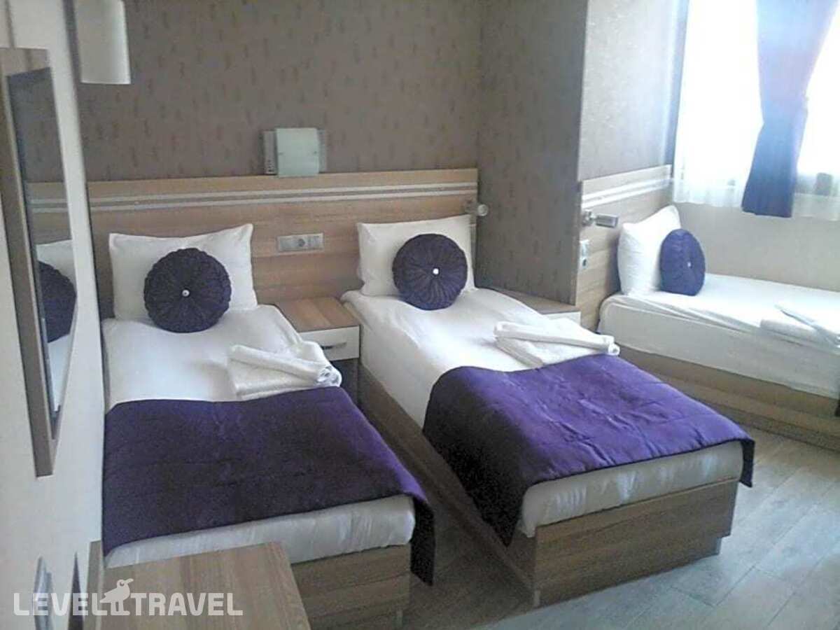 фотографии номера Стандартный (две односпальные кровати) отеля Olimpiyat Otel Izmir в Турция(Измир) - фото №11