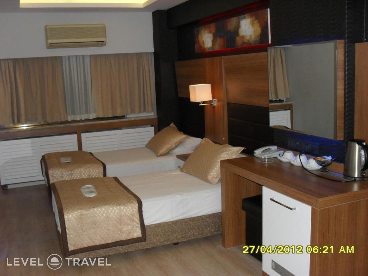фотографии номера Трехместный номер отеля Otel Kabacam в Турция(Измир) - фото №1