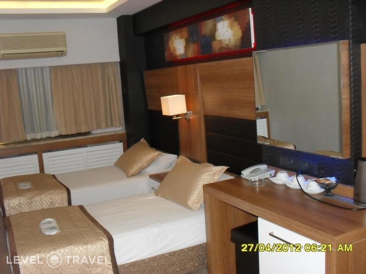 фотографии номера Трехместный номер отеля Otel Kabacam в Турция(Измир) - фото №3