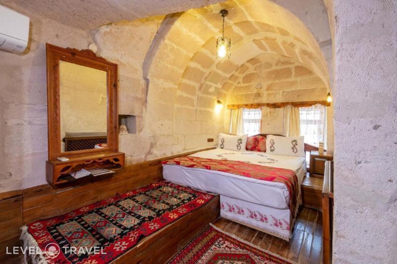 фотографии номера Стандартный (две односпальные кровати) отеля Gamirasu Cave Hotel в Турция(Ургюп) - фото №9