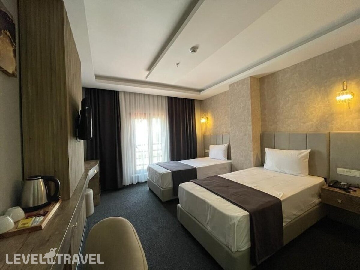 фотографии номера Стандартный (две односпальные кровати) отеля Sevcan Hotel в Турция(Бакыркёй) - фото №1
