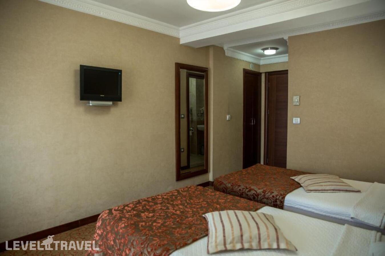 фотографии номера Стандартный (две односпальные кровати) отеля Yuksel Hotel в Турция(Фатих) - фото №1