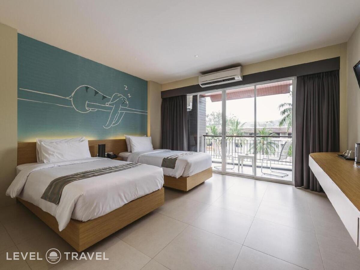 фотографии номера Делюкс (две односпальные кровати) отеля Tiras Patong Beach Hotel в Таиланд(Патонг Бич) - фото №1
