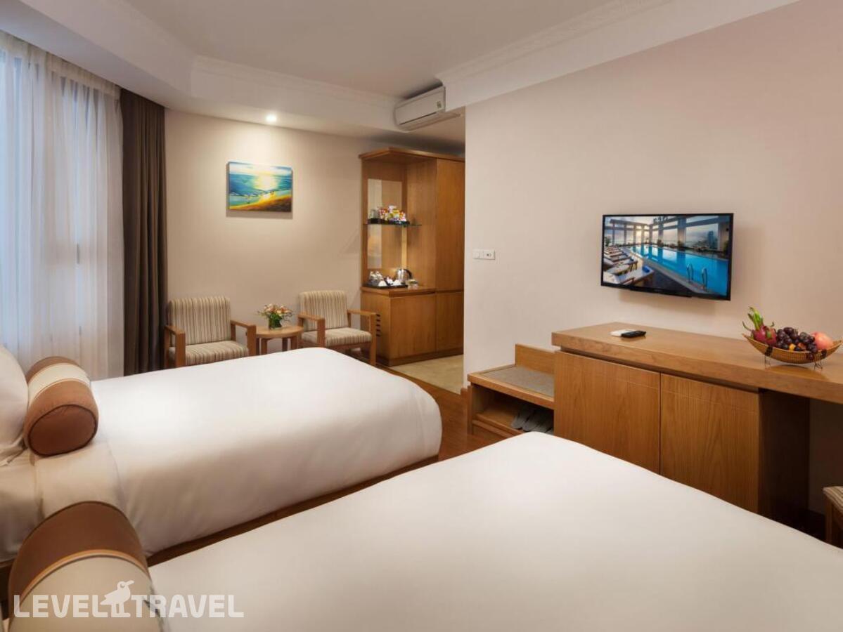 фотографии номера Улучшенный (две односпальные кровати) отеля Diamond Sea Hotel в Вьетнам(Дананг) - фото №1
