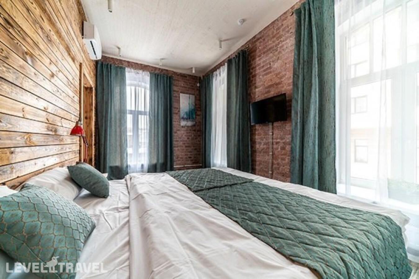 фотографии номера Делюкс (двуспальная кровать и две односпальные) отеля Loft Garden в Россия(Центральный район) - фото №3