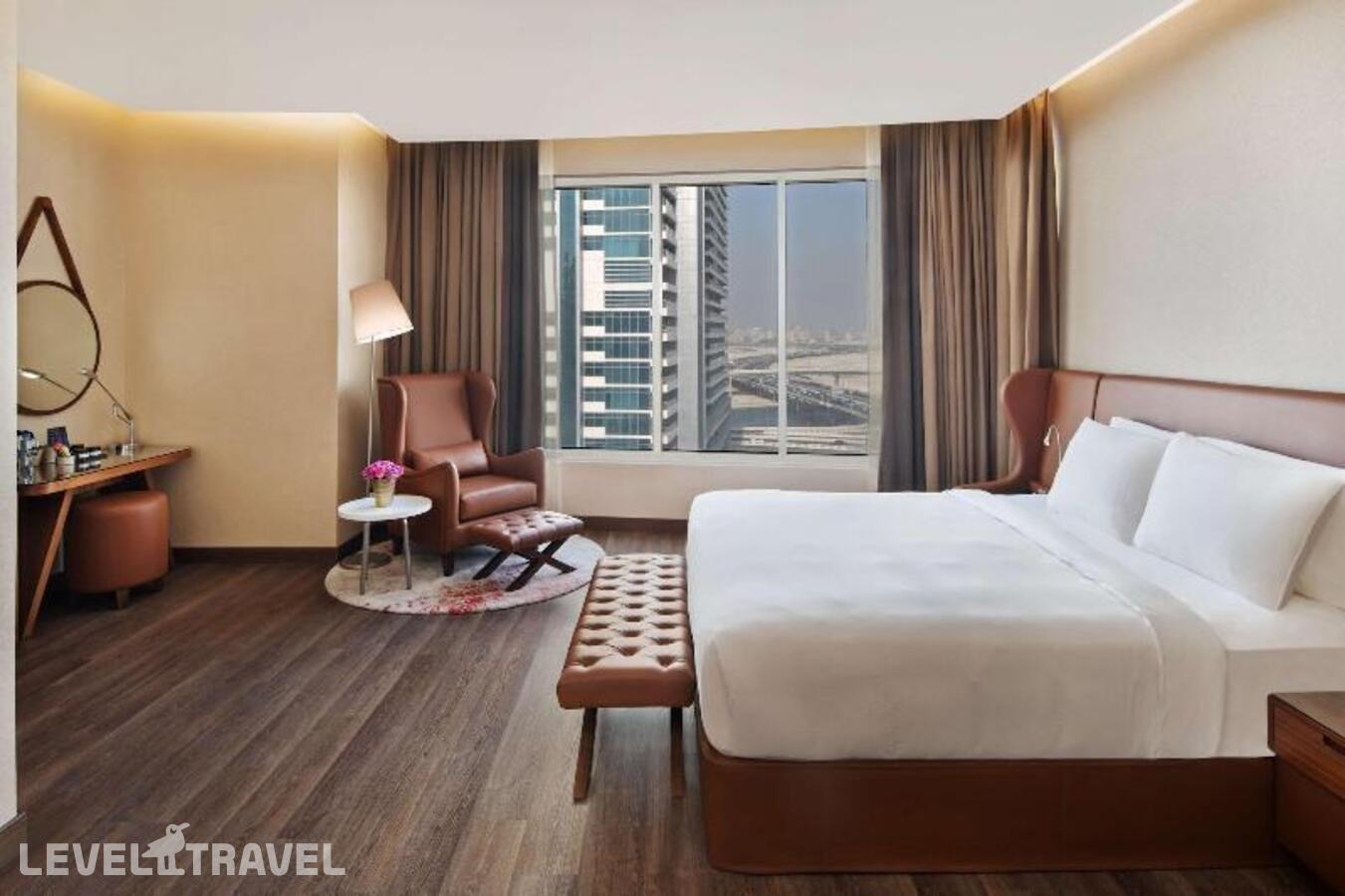 фотографии номера Улучшенный (две односпальные кровати) отеля Radisson Blu Dubai Canal View в ОАЭ(Бизнес Бей) - фото №8
