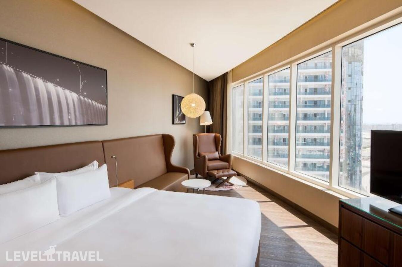 фотографии номера Улучшенный (две односпальные кровати) отеля Radisson Blu Dubai Canal View в ОАЭ(Бизнес Бей) - фото №4