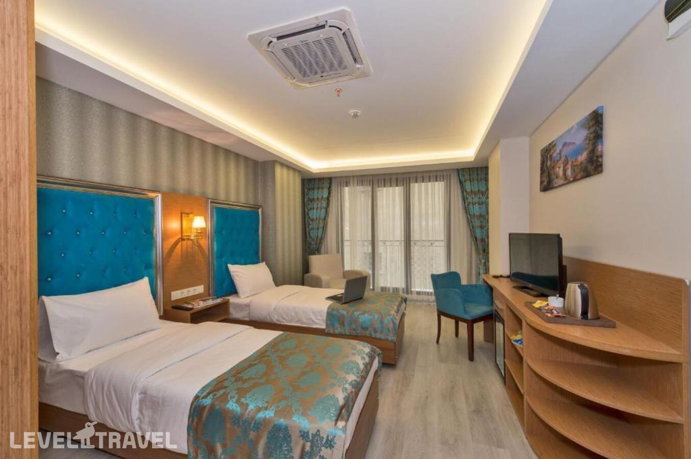 фотографии номера Делюкс (две односпальные кровати) отеля Grand Palace Hotel в Турция(Бахчелиэвлер) - фото №11