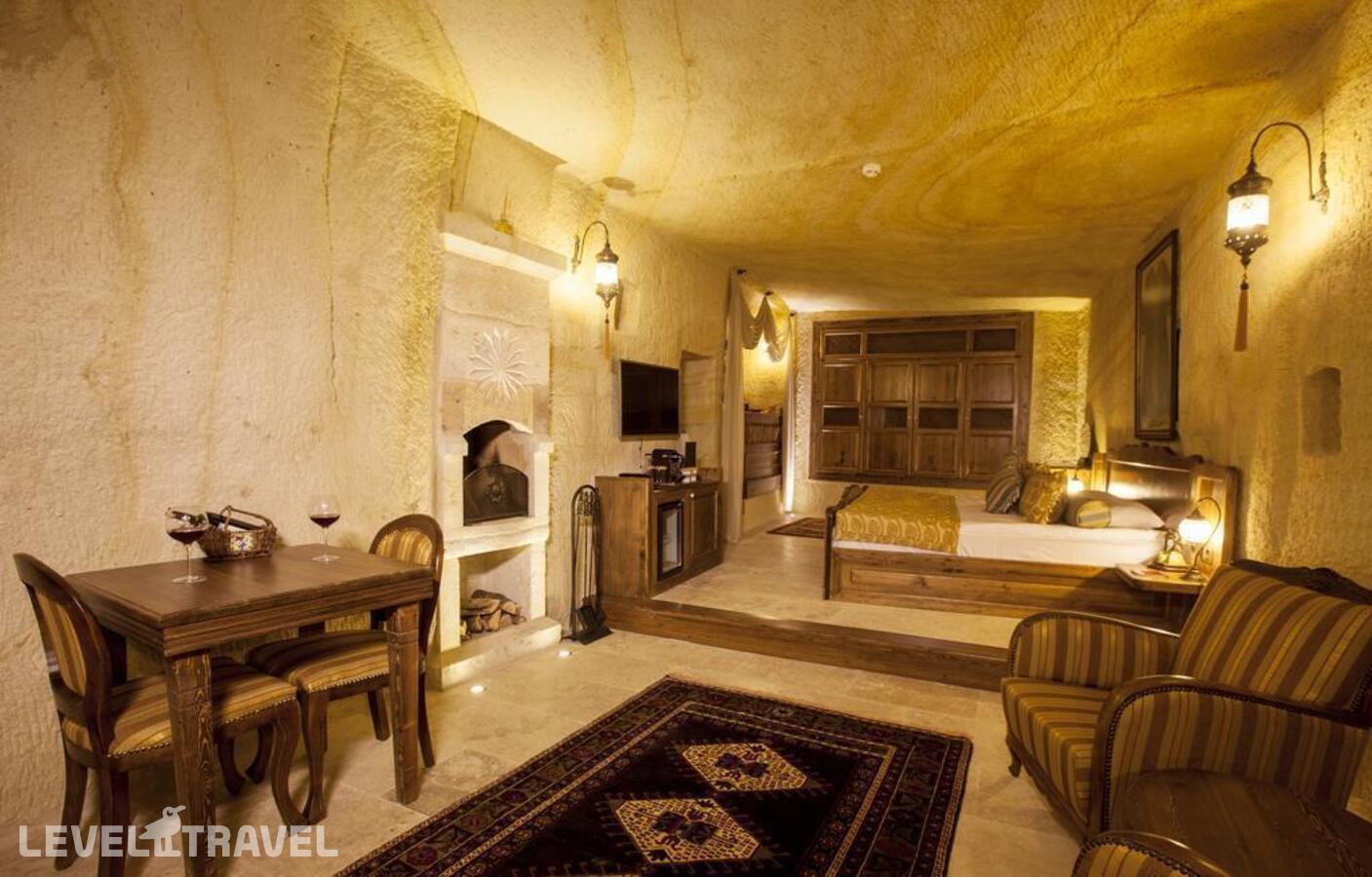фотографии номера Люкс Majestic Cave отеля Kayakapi Premium Caves Cappadocia Hotel в Турция(Ургюп) - фото №1