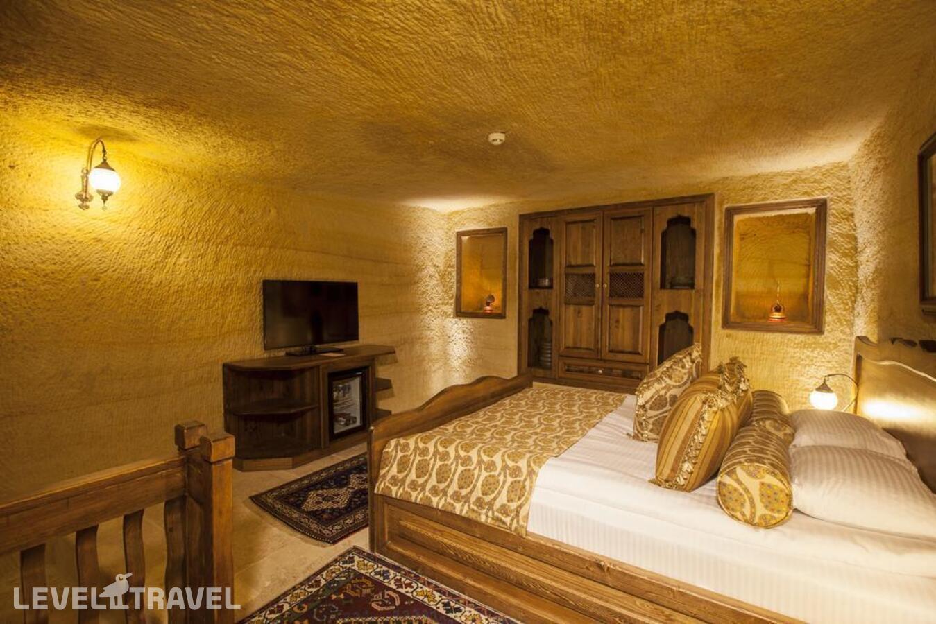 фотографии номера Люкс Glorious Cave отеля Kayakapi Premium Caves Cappadocia Hotel в Турция(Ургюп) - фото №1