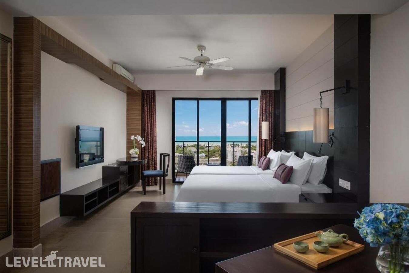 фотографии номера Делюкс с видом на океан отеля Ramada Plaza Sanya Bay (Ex.Sanya Lihe Hotel) в Китай(Санья) - фото №2