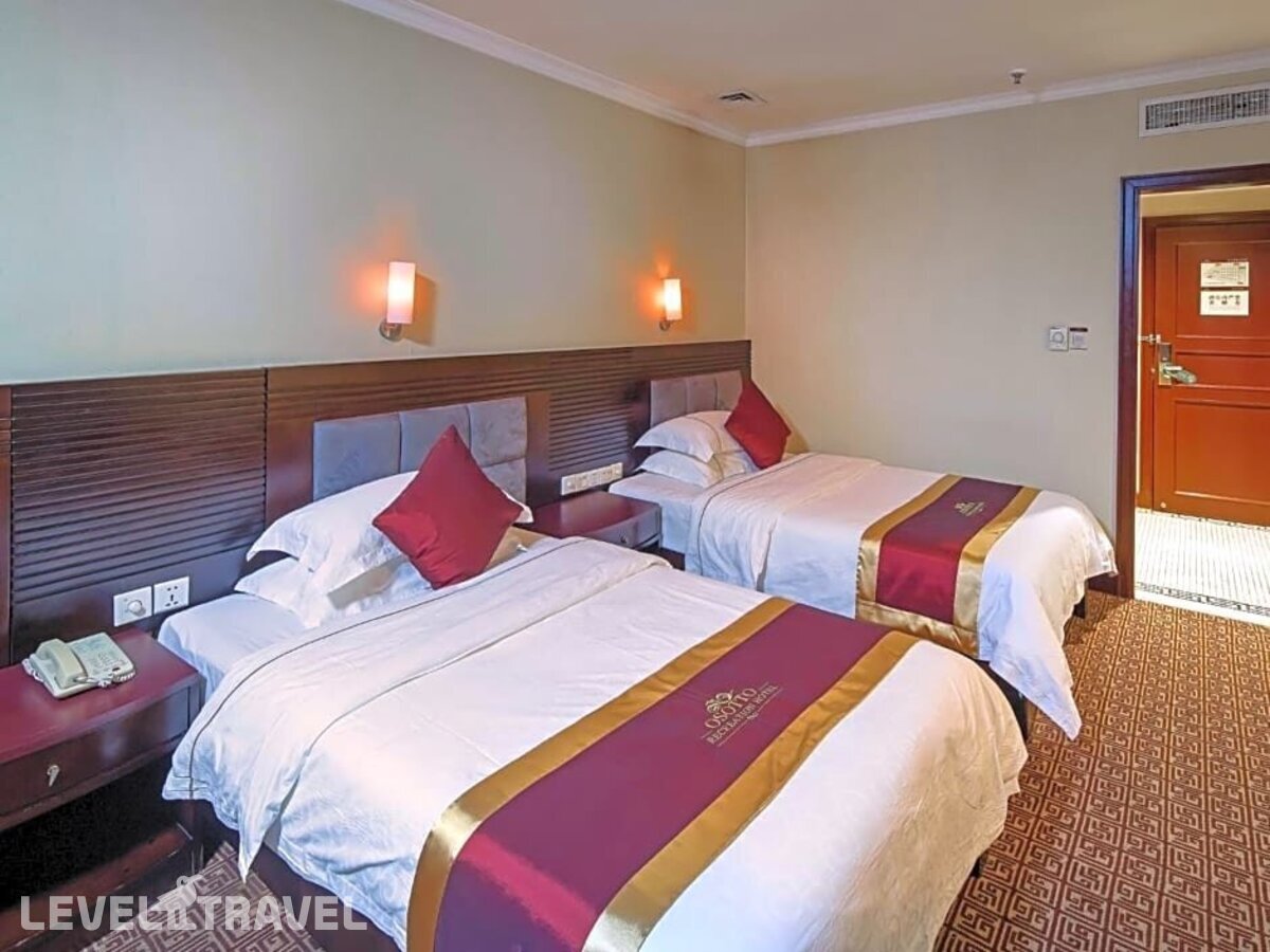 фотографии номера Делюкс (две односпальные кровати) отеля Guangdong Osotto Recreation Hotel в Китай(Гуанчжоу) - фото №5