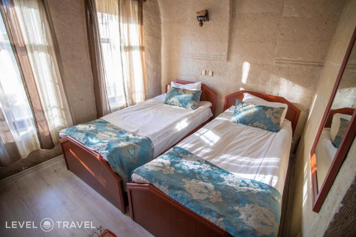 фотографии номера Стандартный (две односпальные кровати) отеля Guven Cave Hotel в Турция(Гёреме) - фото №5