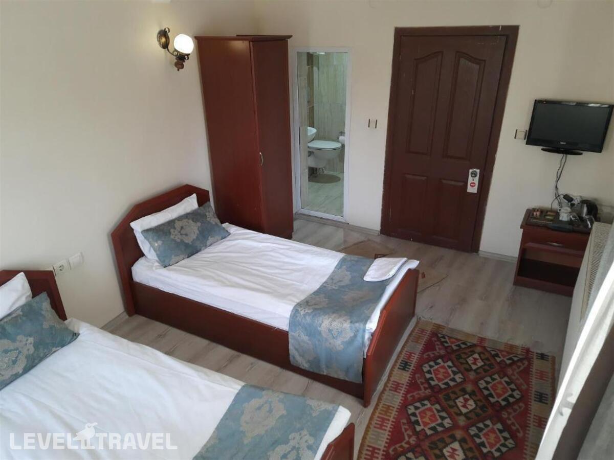 фотографии номера Стандартный (две односпальные кровати) отеля Guven Cave Hotel в Турция(Гёреме) - фото №2