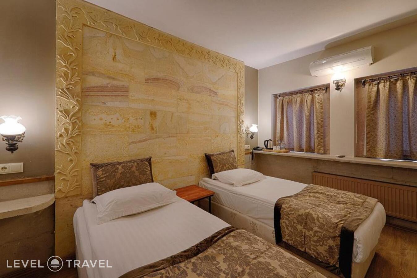 фотографии номера Стандартный (две односпальные кровати) отеля Heybe Hotel в Турция(Гёреме) - фото №6