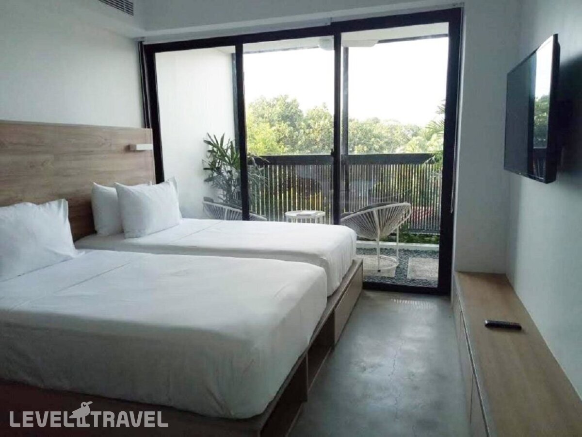 фотографии номера Улучшенный (две односпальные кровати) отеля Lloyd's Inn Bali - Chse Certified в Индонезия(Семиньяк) - фото №1