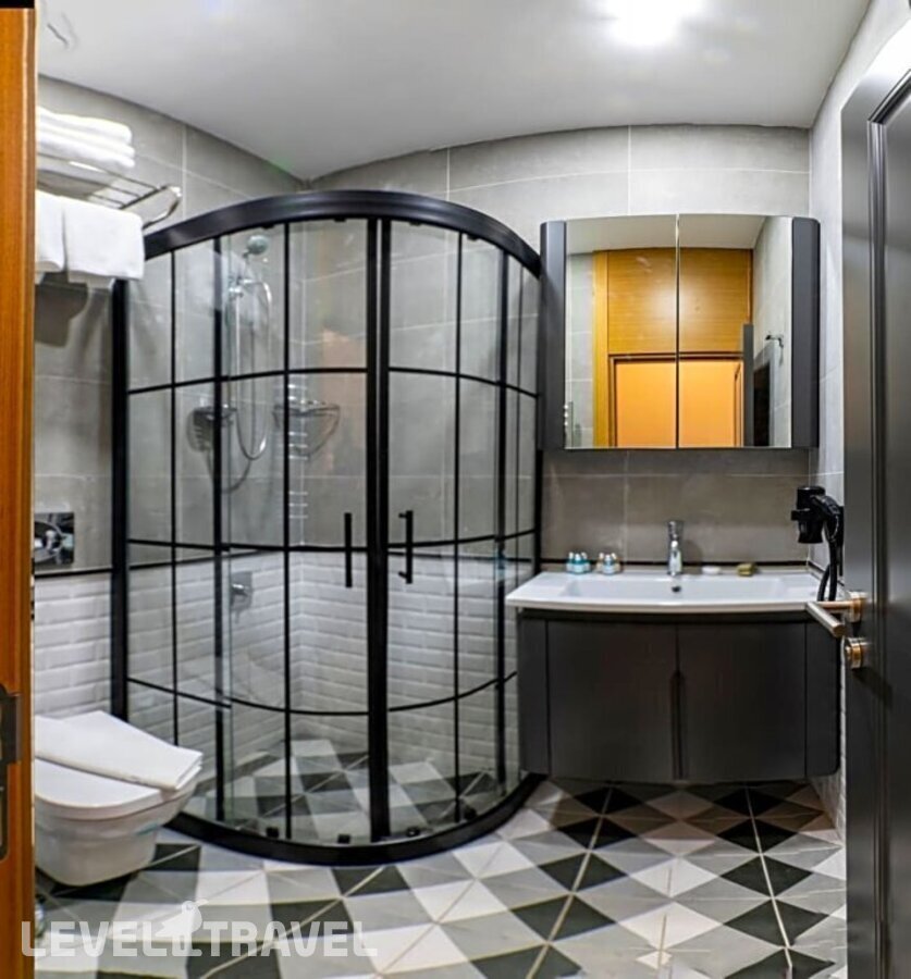 фотографии номера Делюкс (две односпальные кровати) отеля Confores Hotel в Турция(Бахчелиэвлер) - фото №1