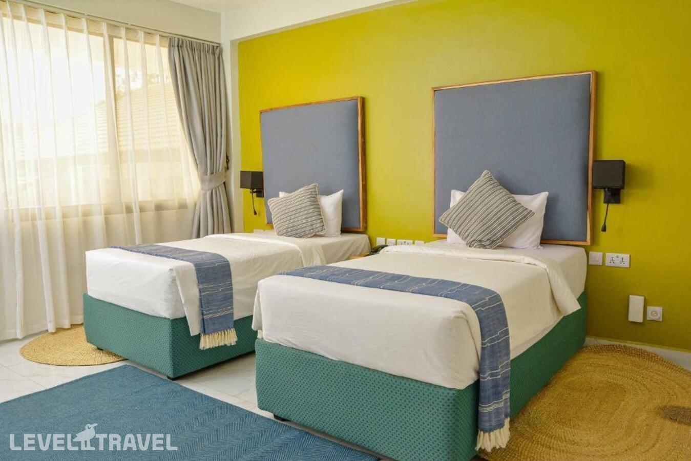 фотографии номера Делюкс (две односпальные кровати) отеля Jangwani Sea Breeze Resort в Танзания(Дар-эс-Салам) - фото №4